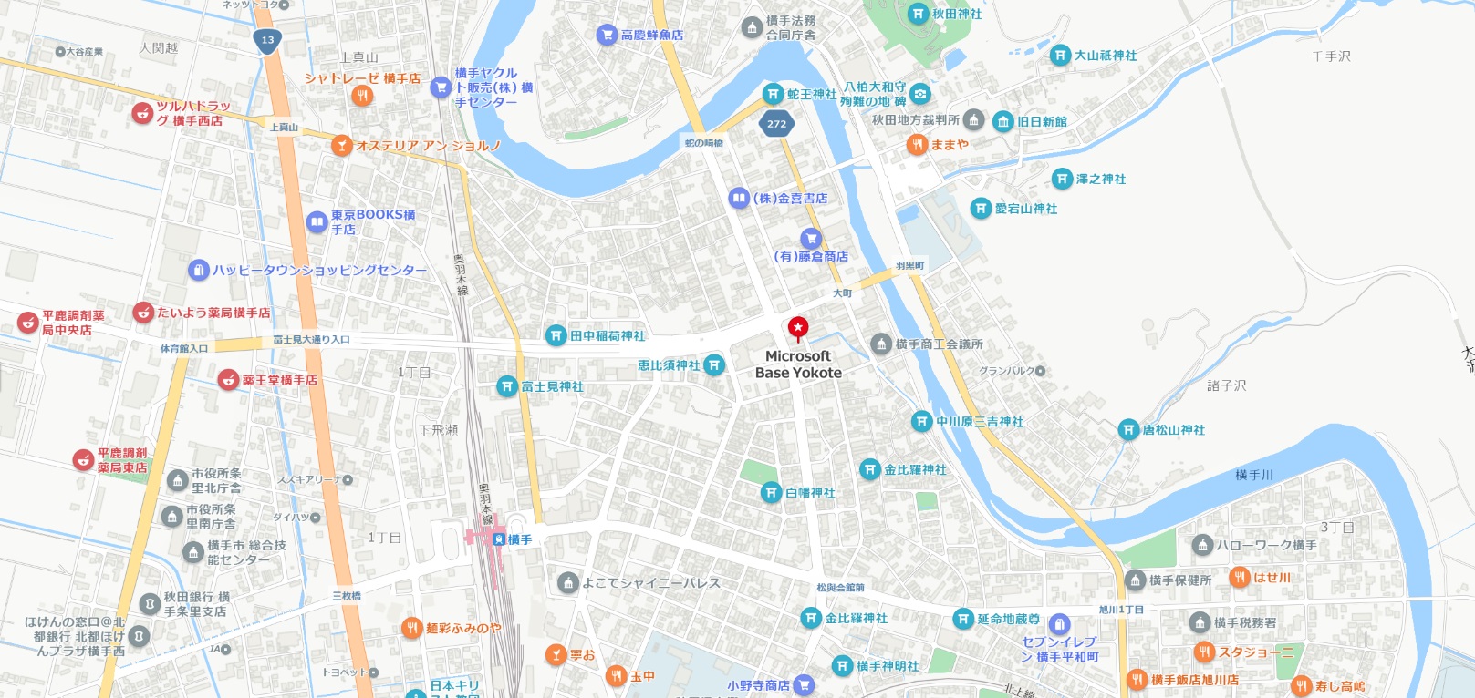 横手市街地の地図で、道路、建物、河川、鉄道が描かれており、「Microsoft Base Yokote」が赤ピンで示されています。