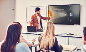 Image of a presenter giving a presentation in PowerPoint.