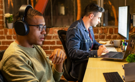Two men at PC workstations.