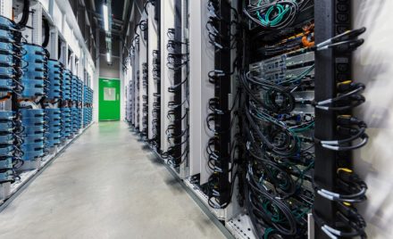 Microsoft datacenter hot aisle row of tall server racks left.